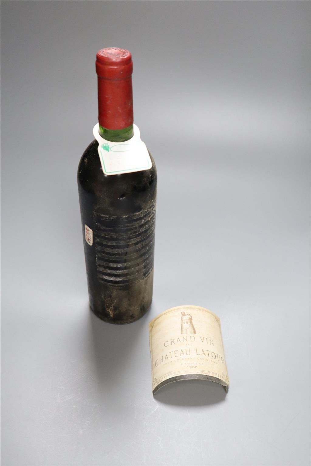 A bottle of Chateau Latour 1980, label detached